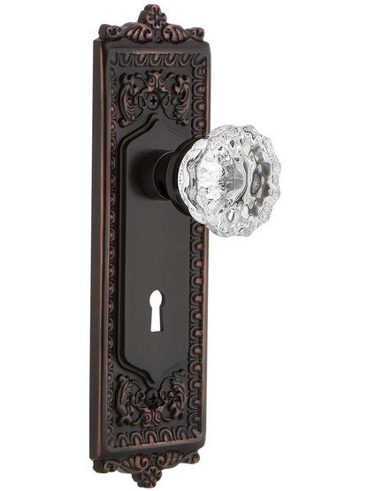 Egg and Dart Design Mortise Lock Set With Fluted Crystal Door Knobs in Timeless Bronze.